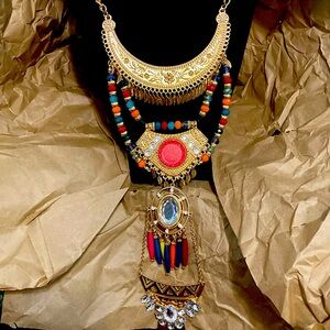 Long ornate costume necklace